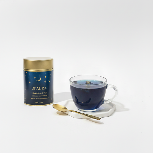 D'Aura lunar calm tea canister with a glass of tea on a white background