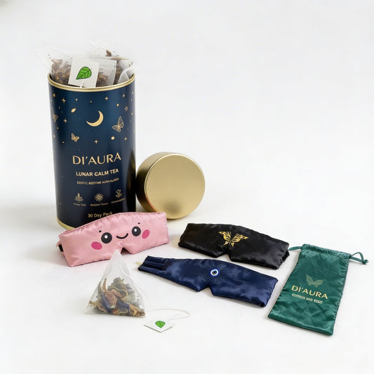 DI'Aura tea packaging set including a cylindrical container, pink sleep mask, black sleep mask, blue sleep mask and green drawstring bag on a white background.